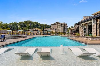 Resort style pool with spa, baja shelf & shaded cabanas